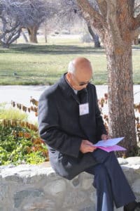 man reading information brochures