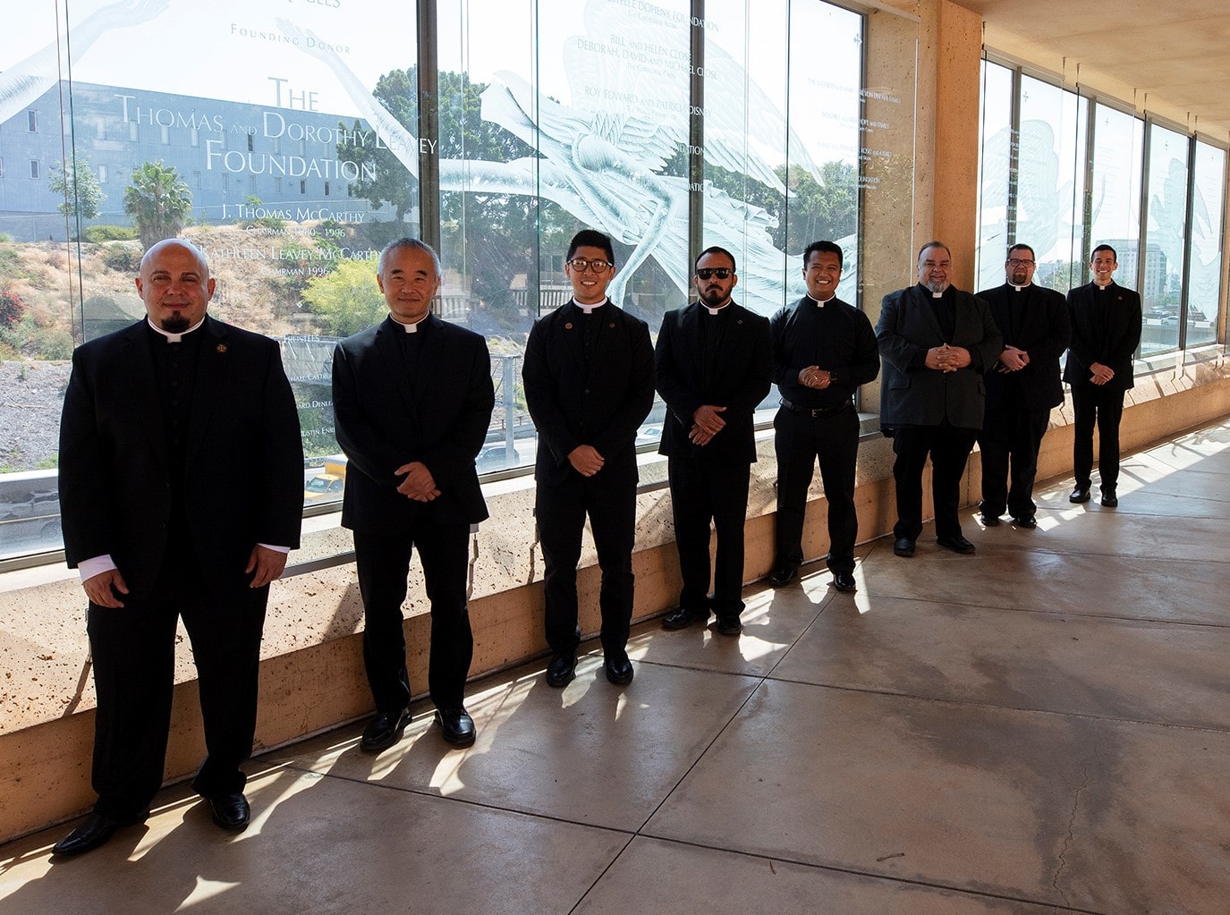 The eight priests ordained on August 8