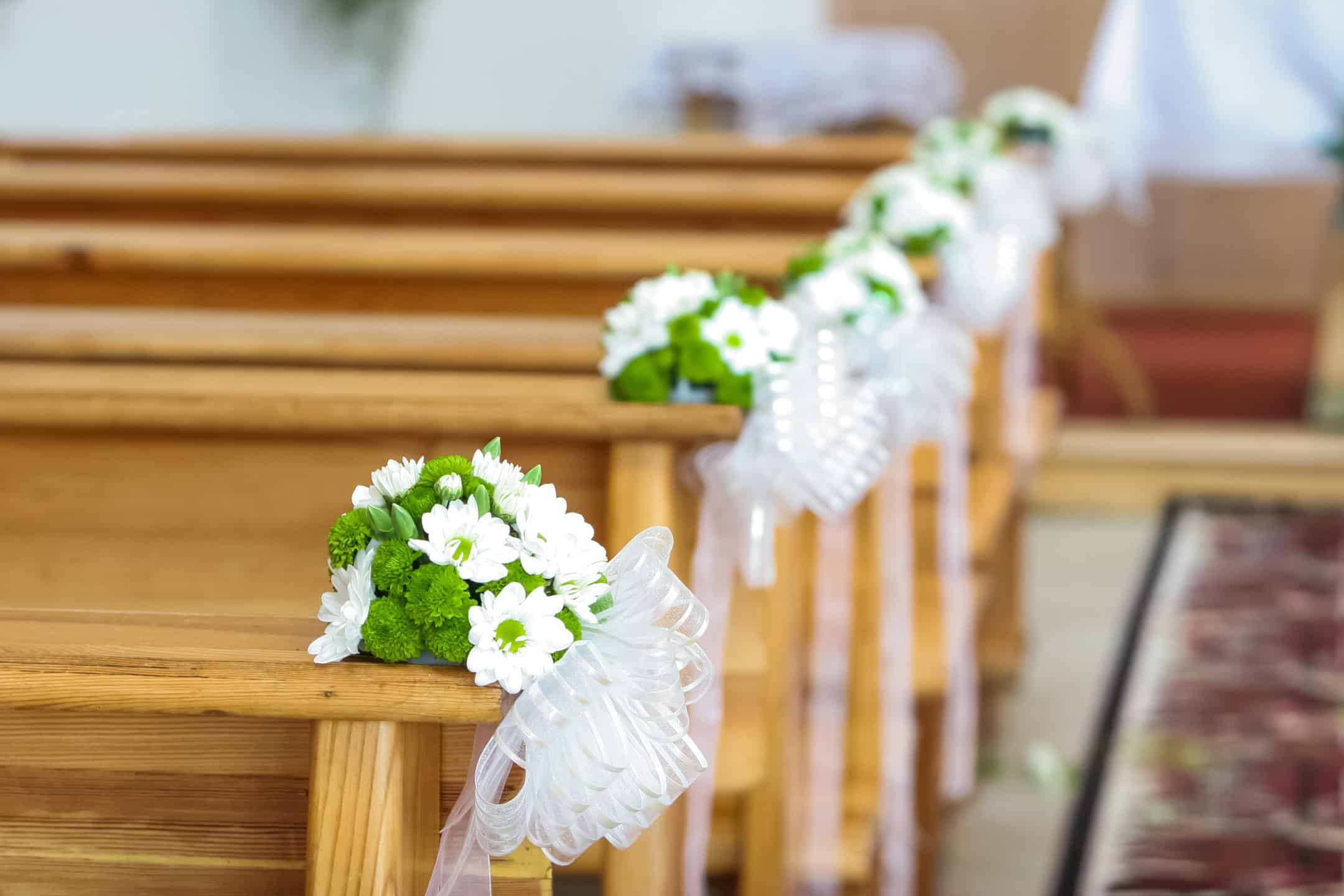 decorated pews before a First Communion celebration