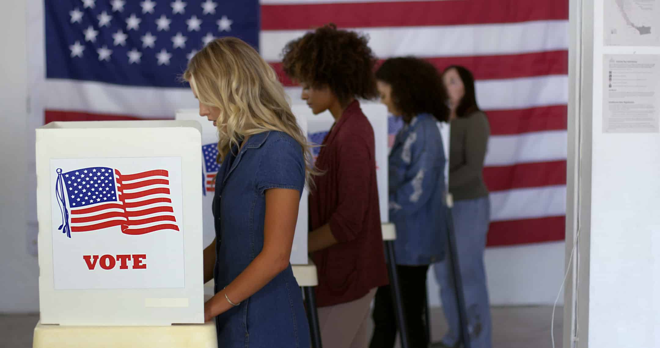 four women casting their ballots