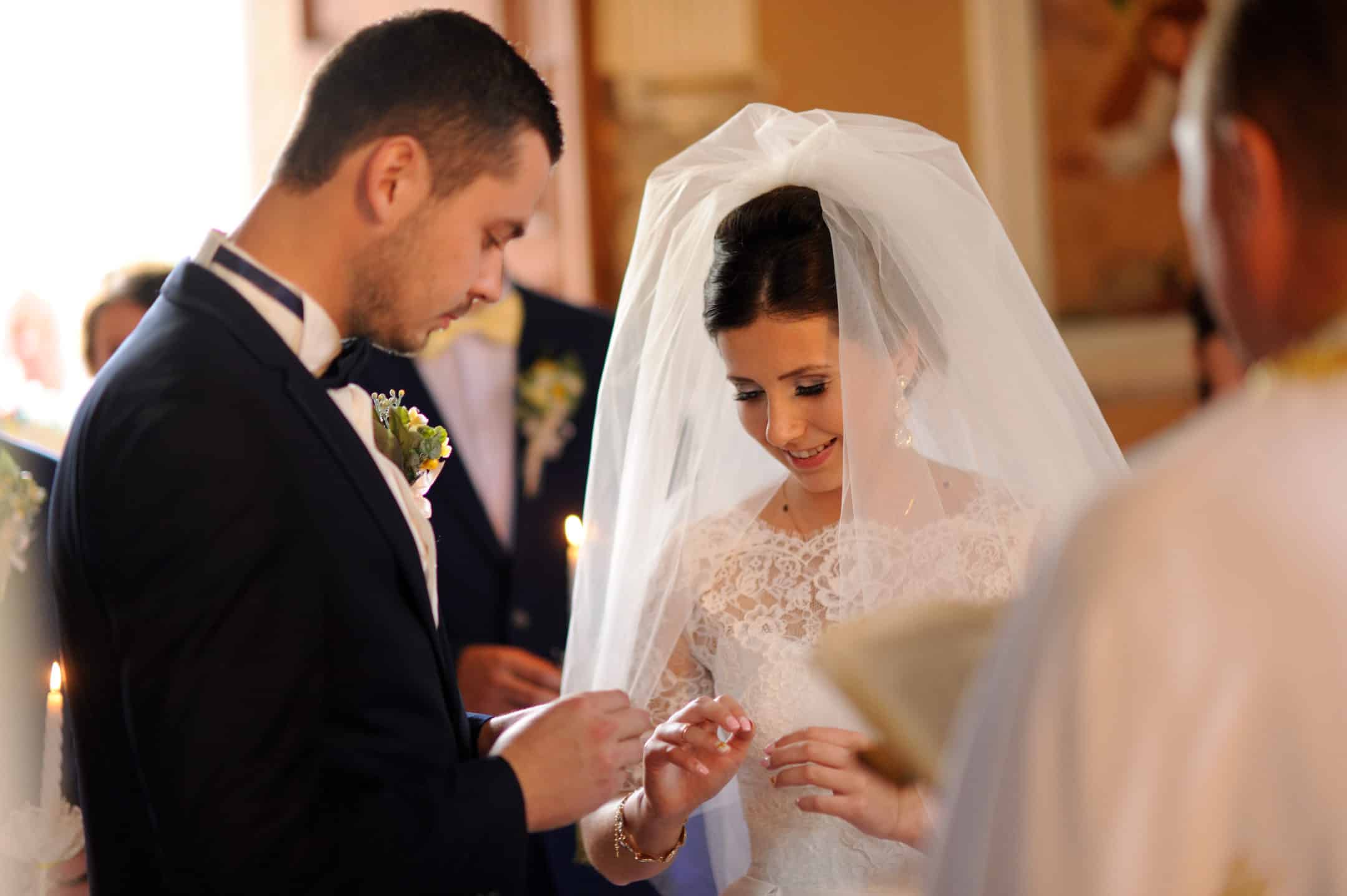 Bride and Groom exchanging rings during marriage ceremony