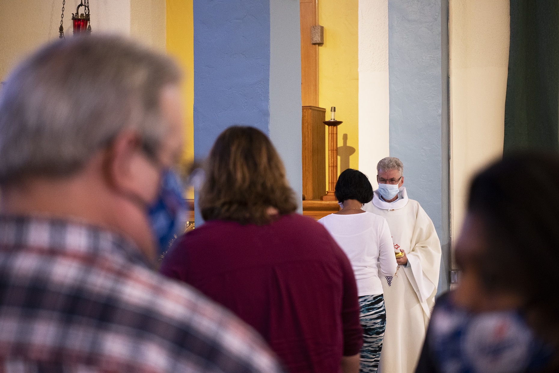 Parishioners attend their first Mass with COVID-19 safety measures