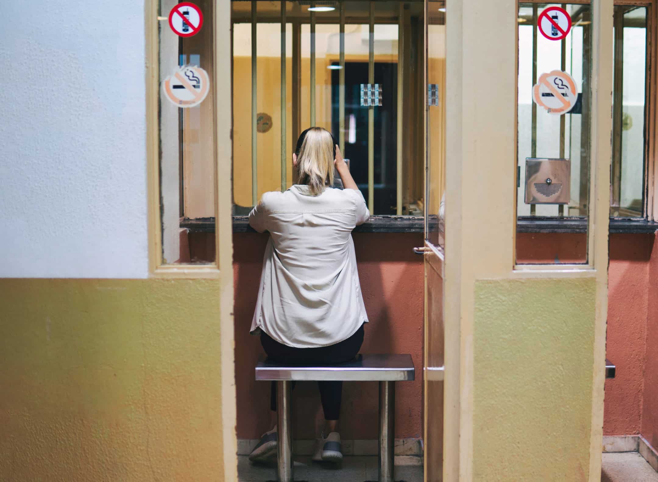 Woman waiting to visit a prisoner