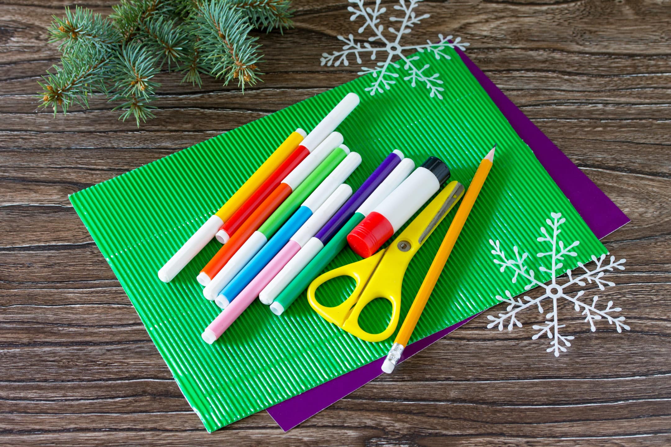 Pens, scissors and paper for Christmas cards