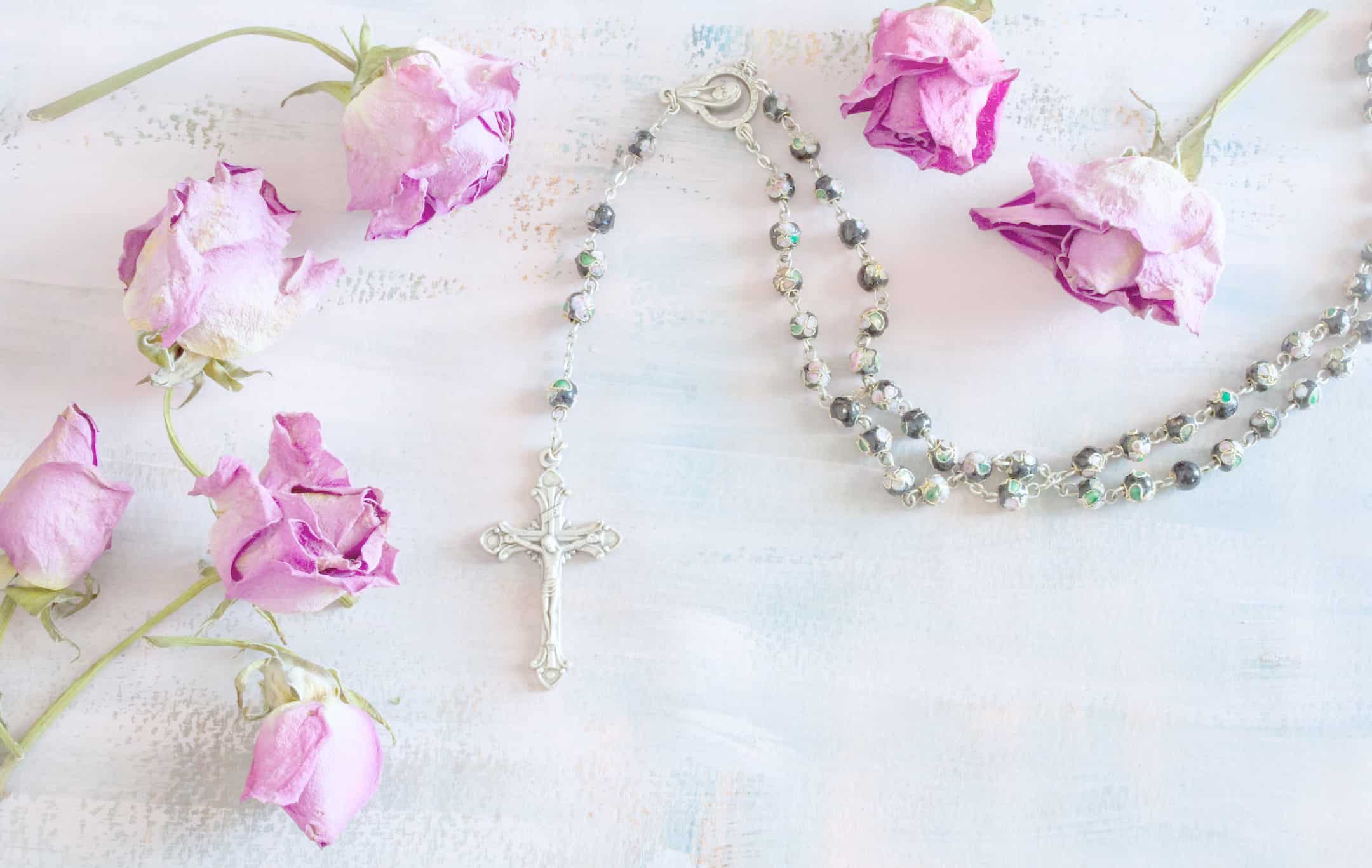 rosary and dry flower pink roses