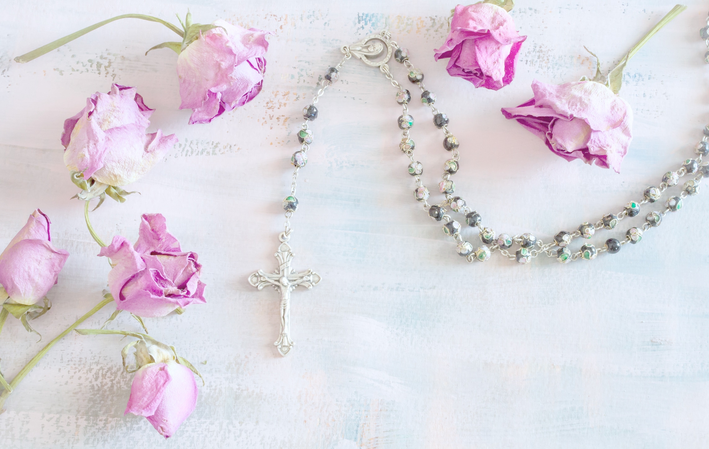 rosary and dry flower pink roses