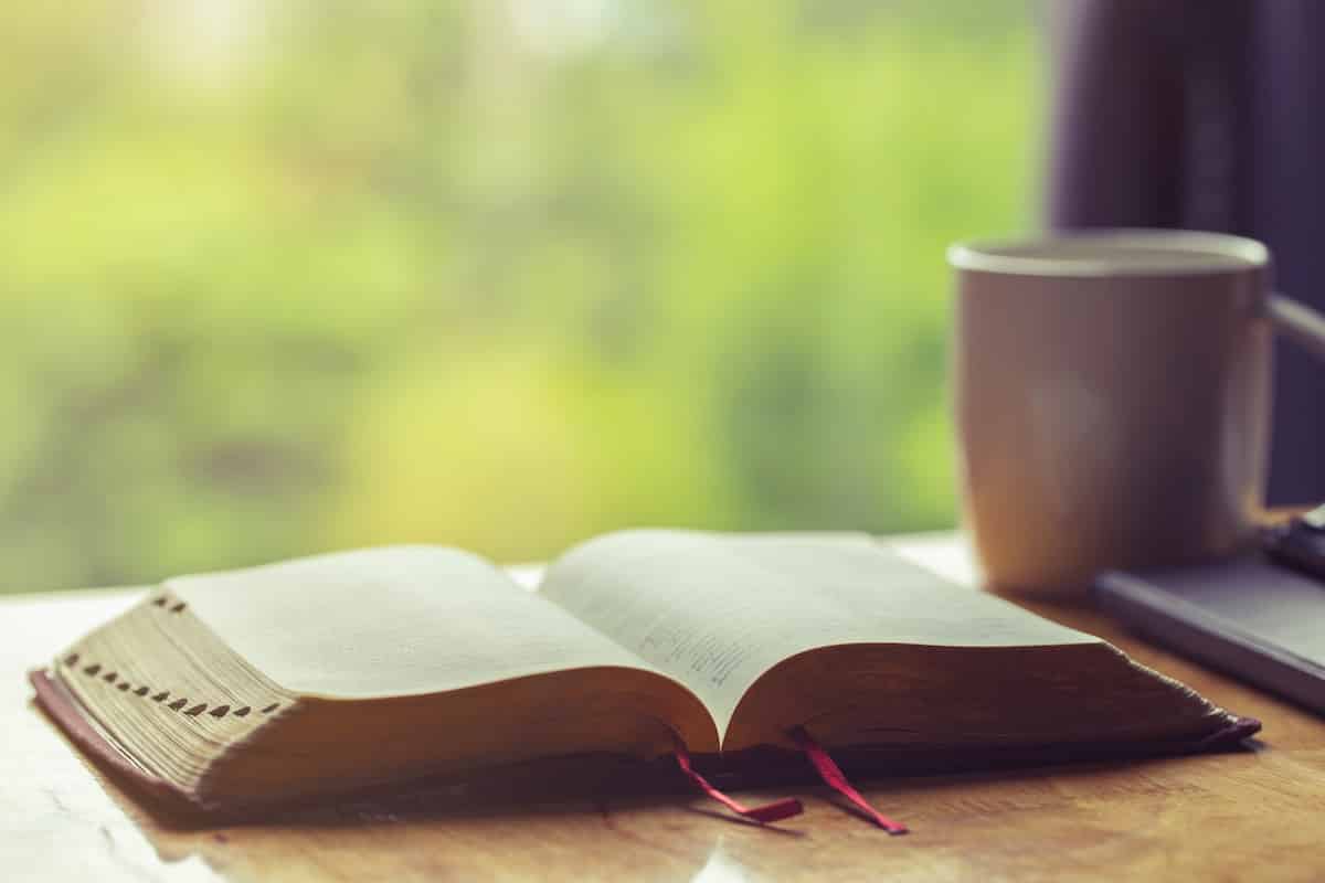 Open Bible With A Cup Of Coffee For Morning Devotion