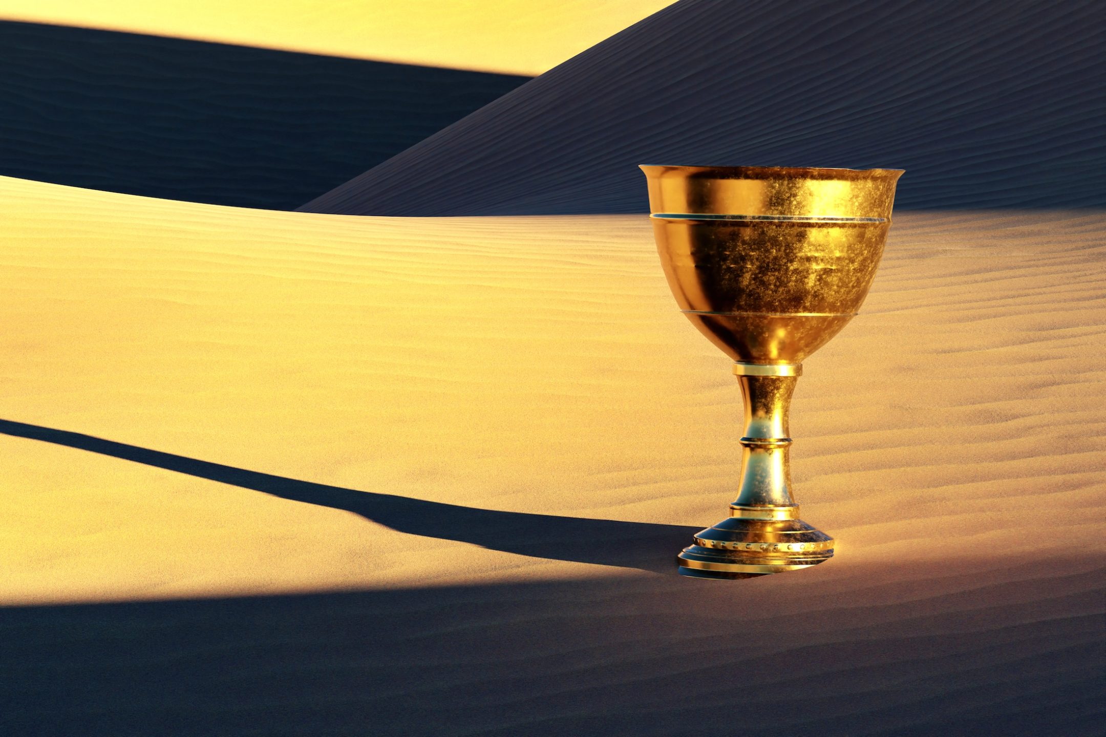 Old copper chalice in the desert sand.