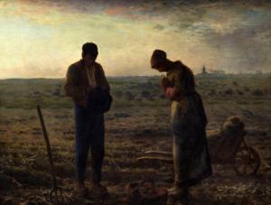 Man and woman standing in a windswept field at twilight, looking down at their hands while a pitchfork rests nearby.